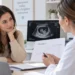 A woman discussing hCG blood test results with a healthcare professional
